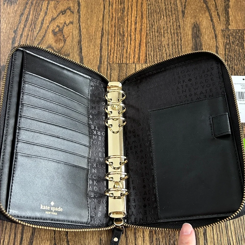Black leather Kate Spade Wellesley zip around personal organizer/planner